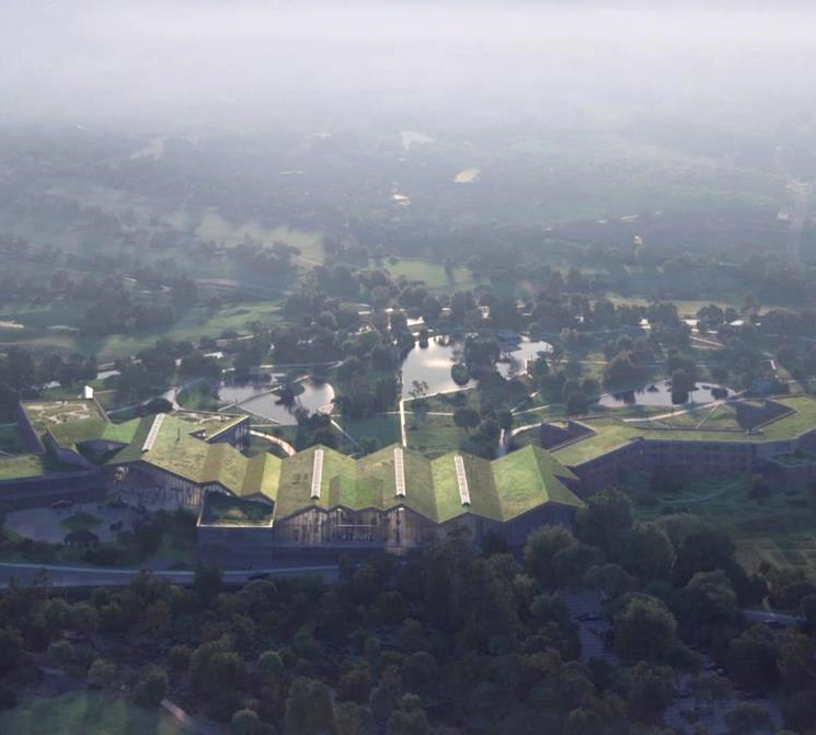 Photot université vu de haut, toit triangulaire et couvert de verdure